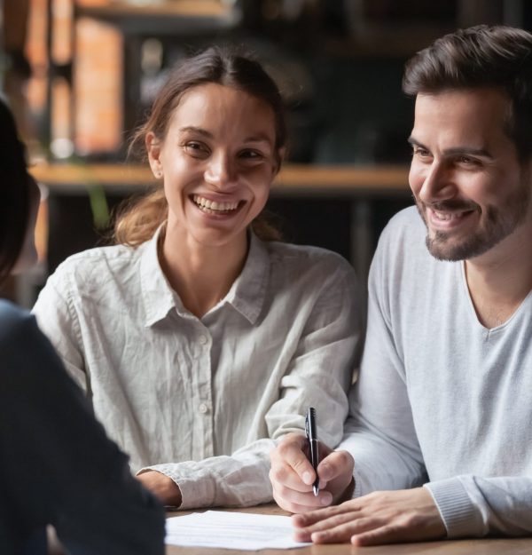 Happy,Young,Customers,Couple,Ready,To,Sign,Bank,Loan,Agreement